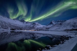 northern lights over fjords in lofoten norway